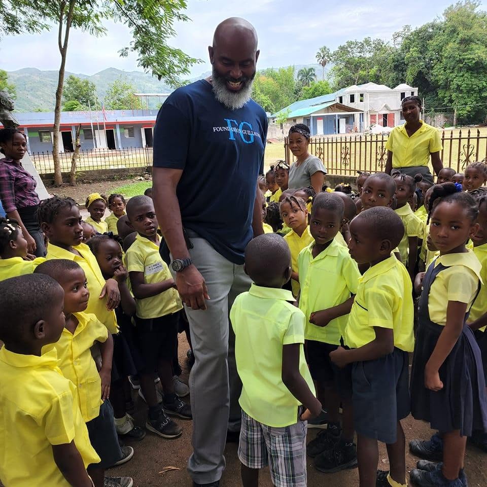 Dr. William Crawley visiting a school